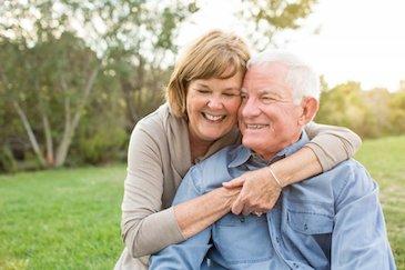 all on x dental implants champaign | couple hugging